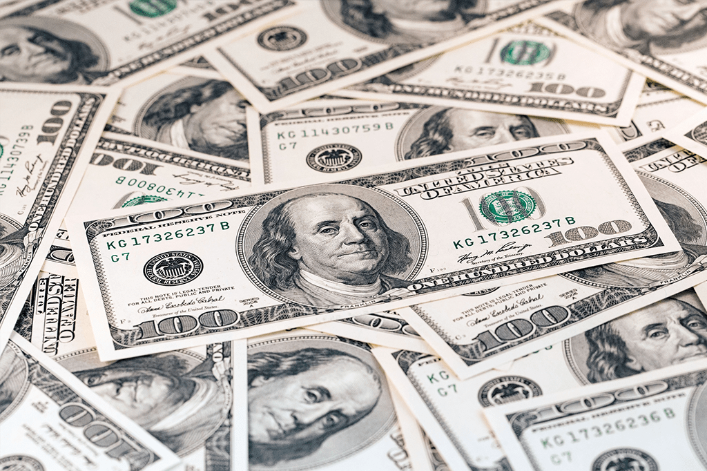 Imagem com vários dólares juntos