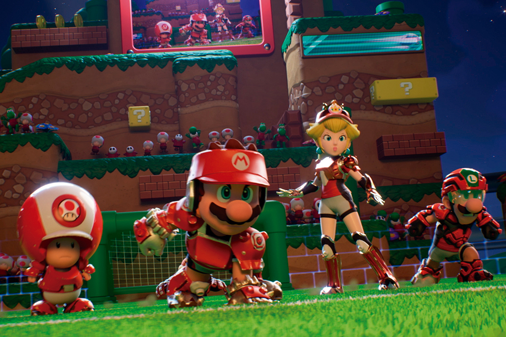 Frame do jogo em que aparece Mario e seus conterr&acirc;neos em um campo de futebol.