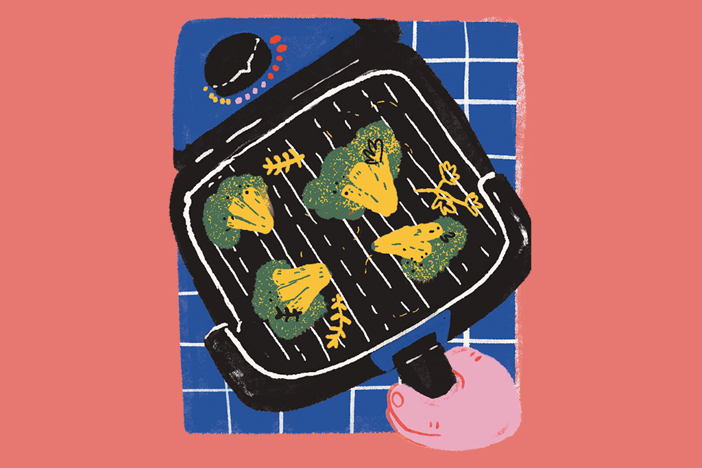 SI_451_ORCL_Manual3 Cena ilustrada de uma mãozinha manuseando o cesto da air fryer, que tem brócolis e ervinhas dentro.