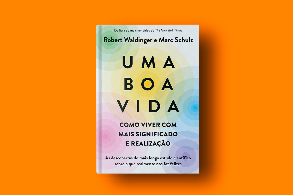 Foto do livro Uma Boa vida sob fundo laranja liso.